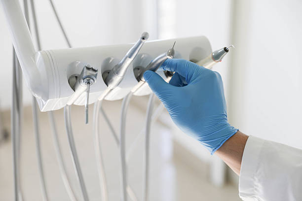 Professional Tooth Extraction technician working in Moultrie County County, IL
